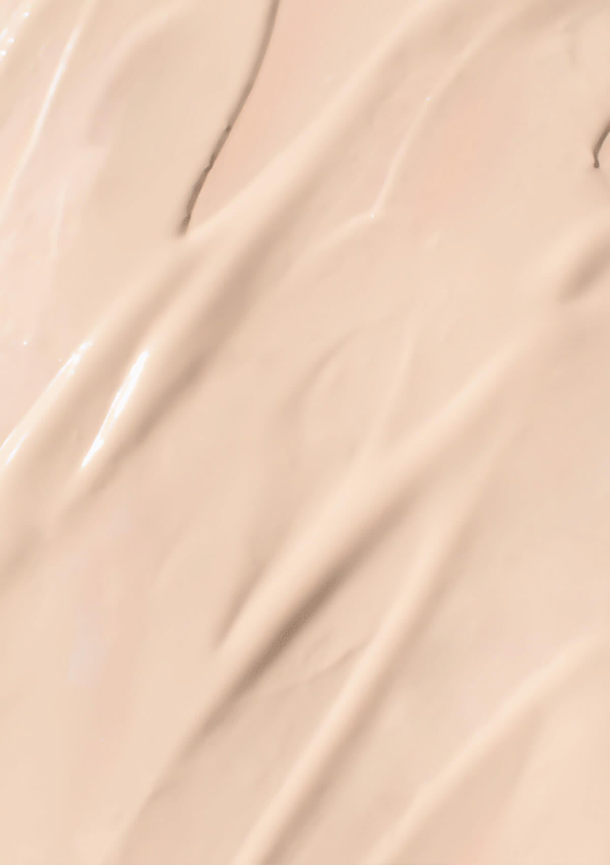 Textur der elfenbeinfarbigen Foundation